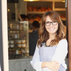 Woman standing in front of coffee shop